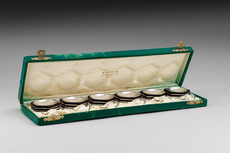 A GAB set of six silver and bakelite salt cellars with salt spoons, Stockholm 1934.