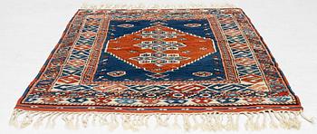 A semi-antique Turkish rug, 175 x 123 cm.