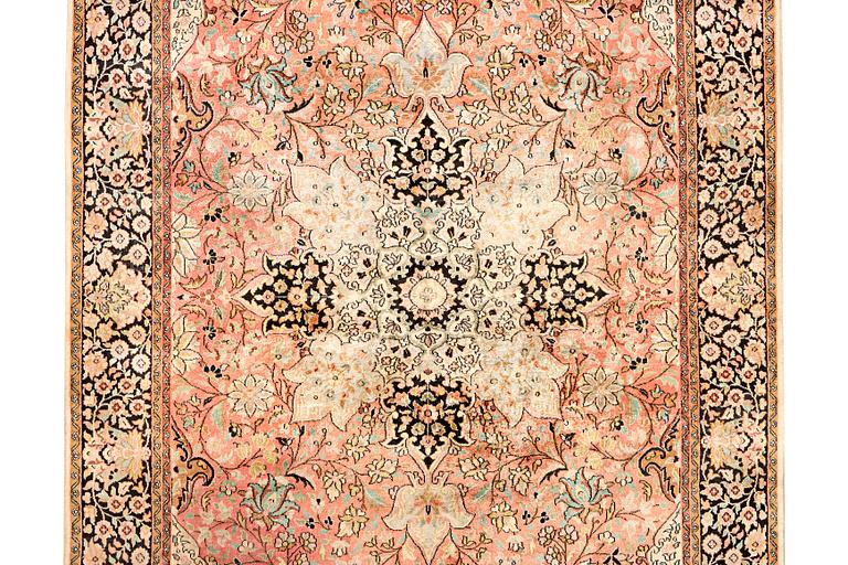 A silk Kashmar carpet, c. 280 x 177 cm.