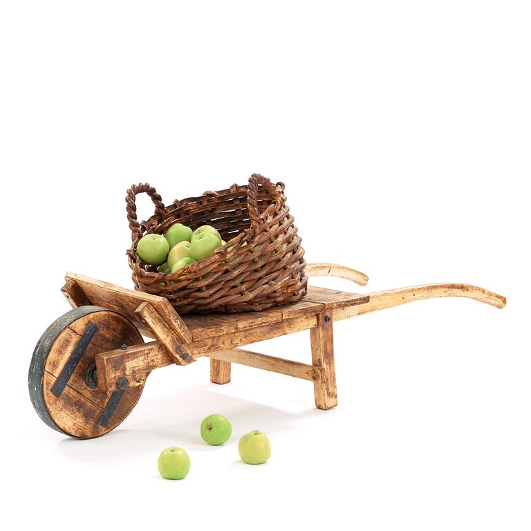 Ingrid Herrlin, a stoneware basket with 30 apples and a wheelbarrow, Sweden ca 1988.