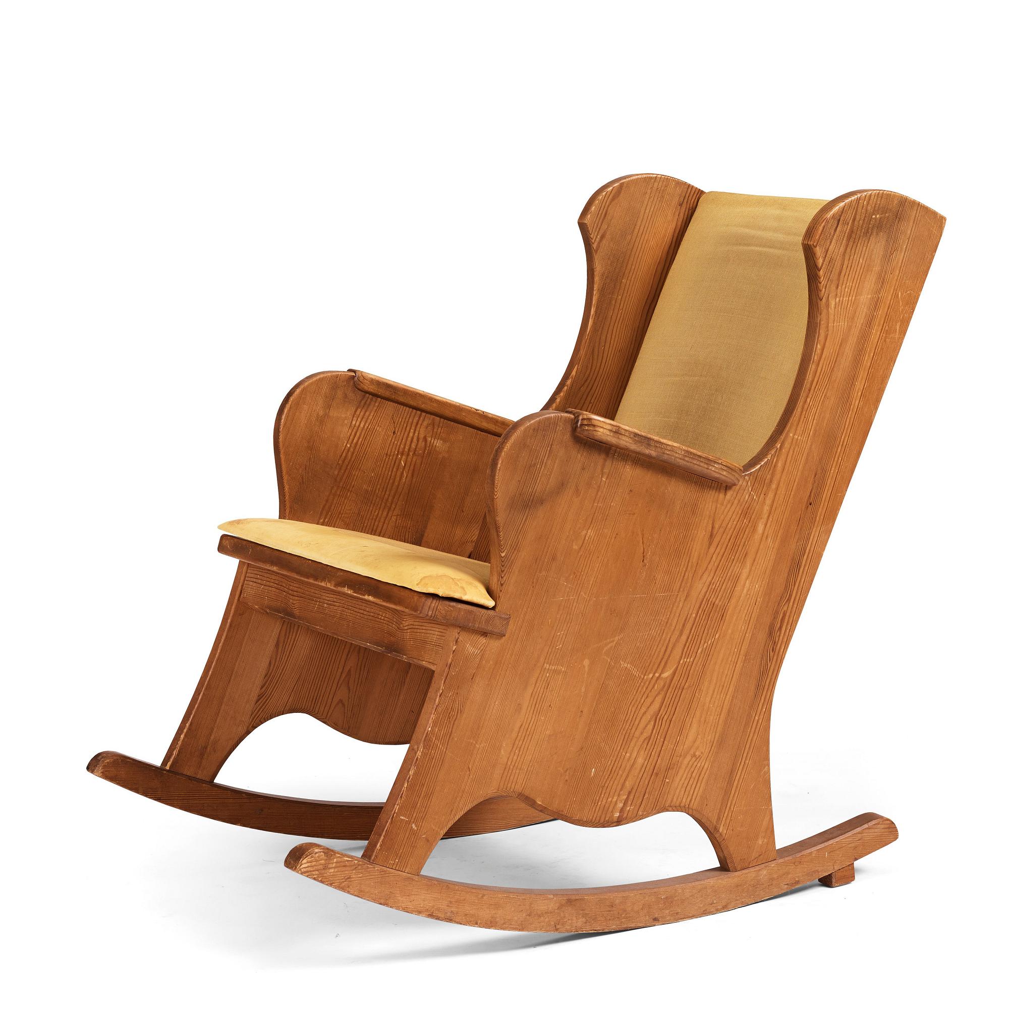 Nordiska Kompaniet, a Swedish Modern stained pine 'Lovö' rocking chair.