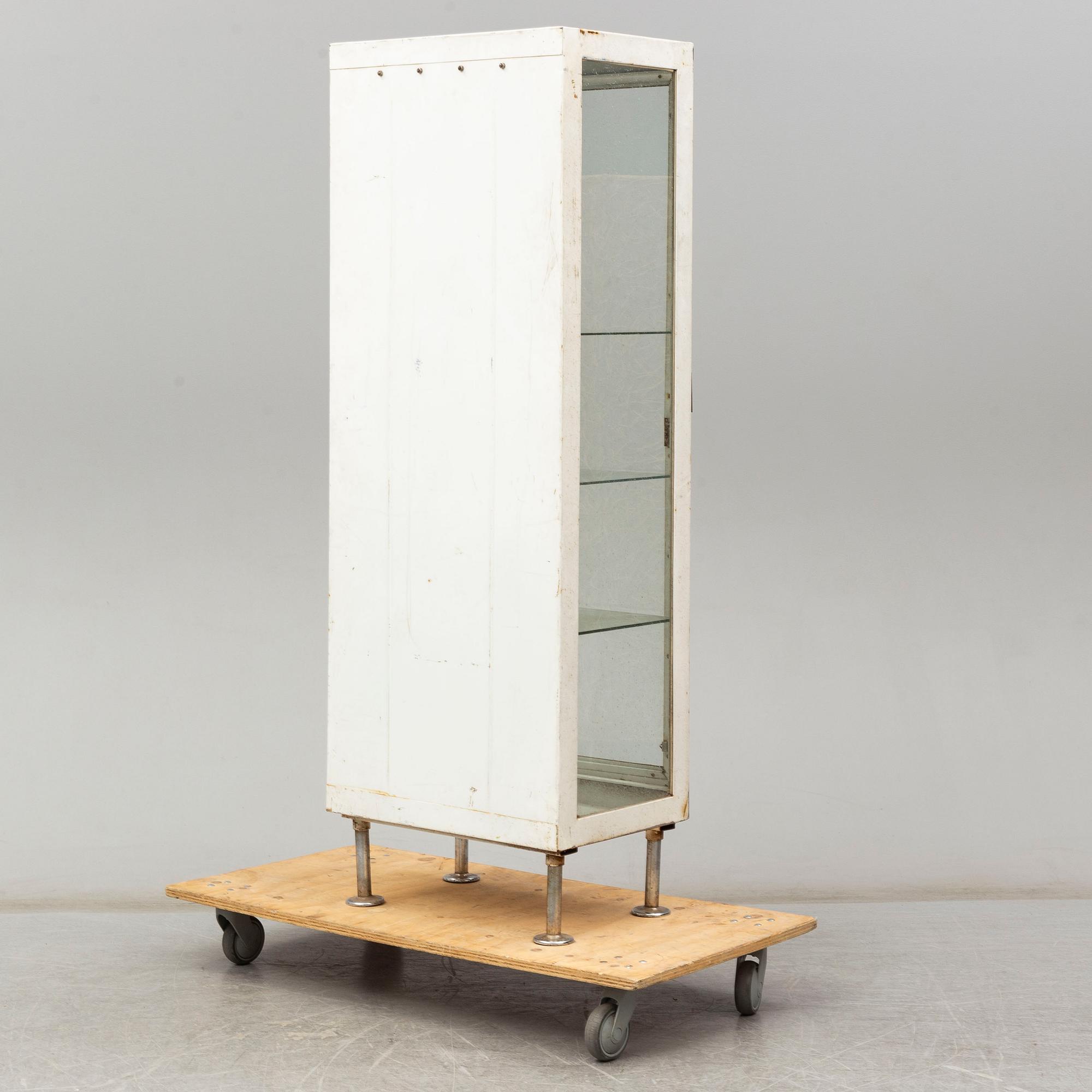 A metal doctor's cabinet, mid 20th century.