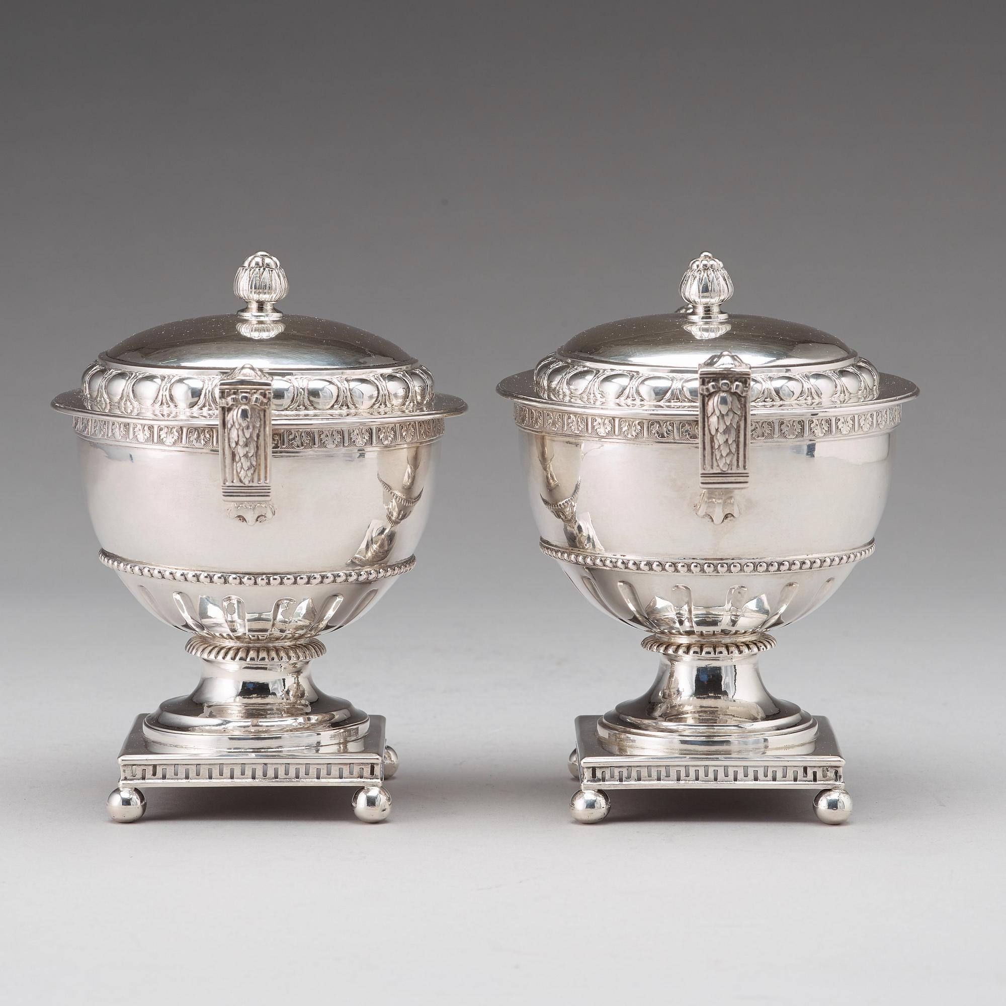 A pair of Swedish late 18th century silver sugar bowls and covers, mark of Pehr Zethelius, Stockholm 1780 and 1781.