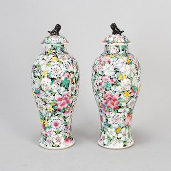A pair of Chinese 'Mille fleur' porcelain vases with covers, 20th century.