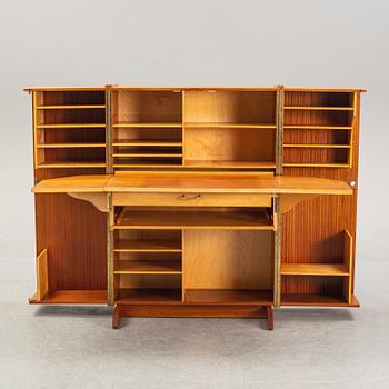 A mahogany veneered convertible cabinet, mid 20th Century.