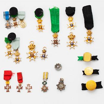 A group of miniature decorations, mostly Swedish.