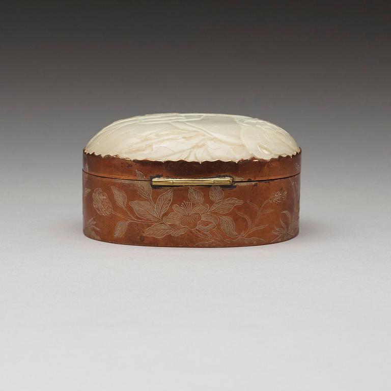 A metal box with cover with a large carved jade plaque, China early 20th Century.