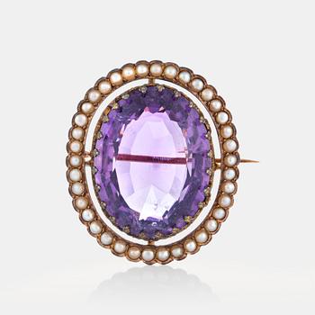 An amethyst brooch set with pearls.