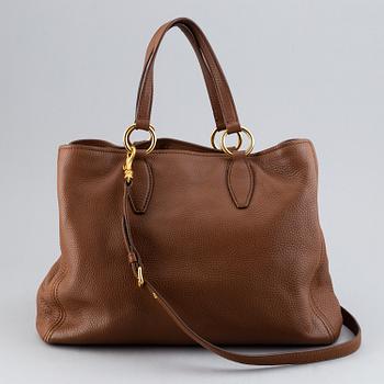 Miu Miu, a leather bag.