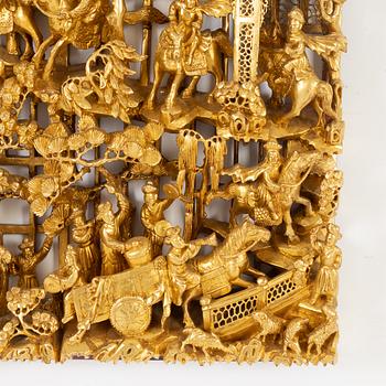 A carved Chinese wooden panel, late Qing dynasty, circa 1900.