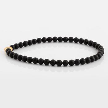 Ole Lynggaard, black stone  bead necklace, clasp star 18K gold with brilliant cut diamond.