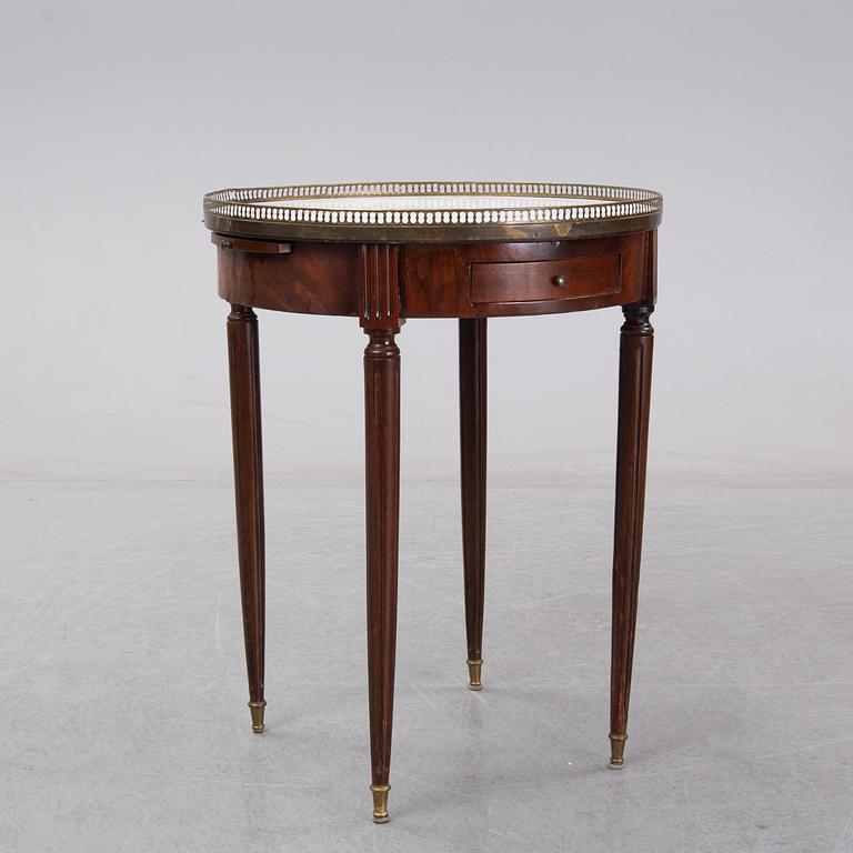 A Louis XVI style marble top mahognay table, circa 1900.