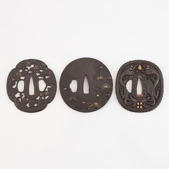 Seven tsuba of different origin, 18th - 20th Century.