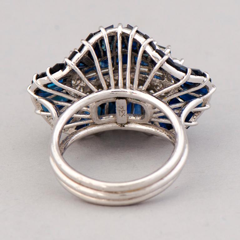 A RING, baguette cut sapphires, brilliant cut diamonds, 14K white gold.