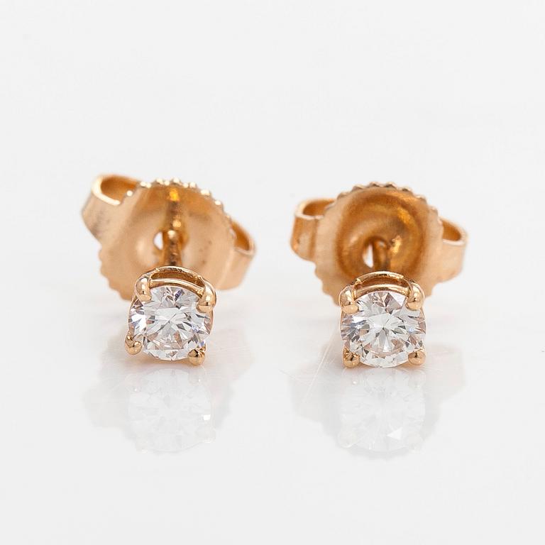 Tiffany & Co, örhängen, "Tiffany Solitaire", 18K guld och briljantslipade diamanter.