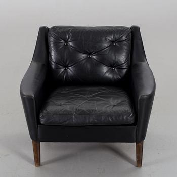 A 1960s Scandinavian black leather easy chair.