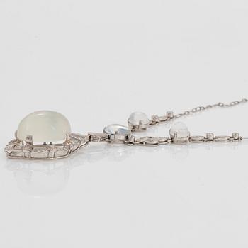 A platinum necklace set with moonstones and old- and eight-cut diamonds.