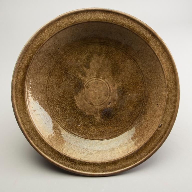 A celadon ge glazed dish, South East Asia, presumably Sawankhalok, 15th/17th Centuyr.