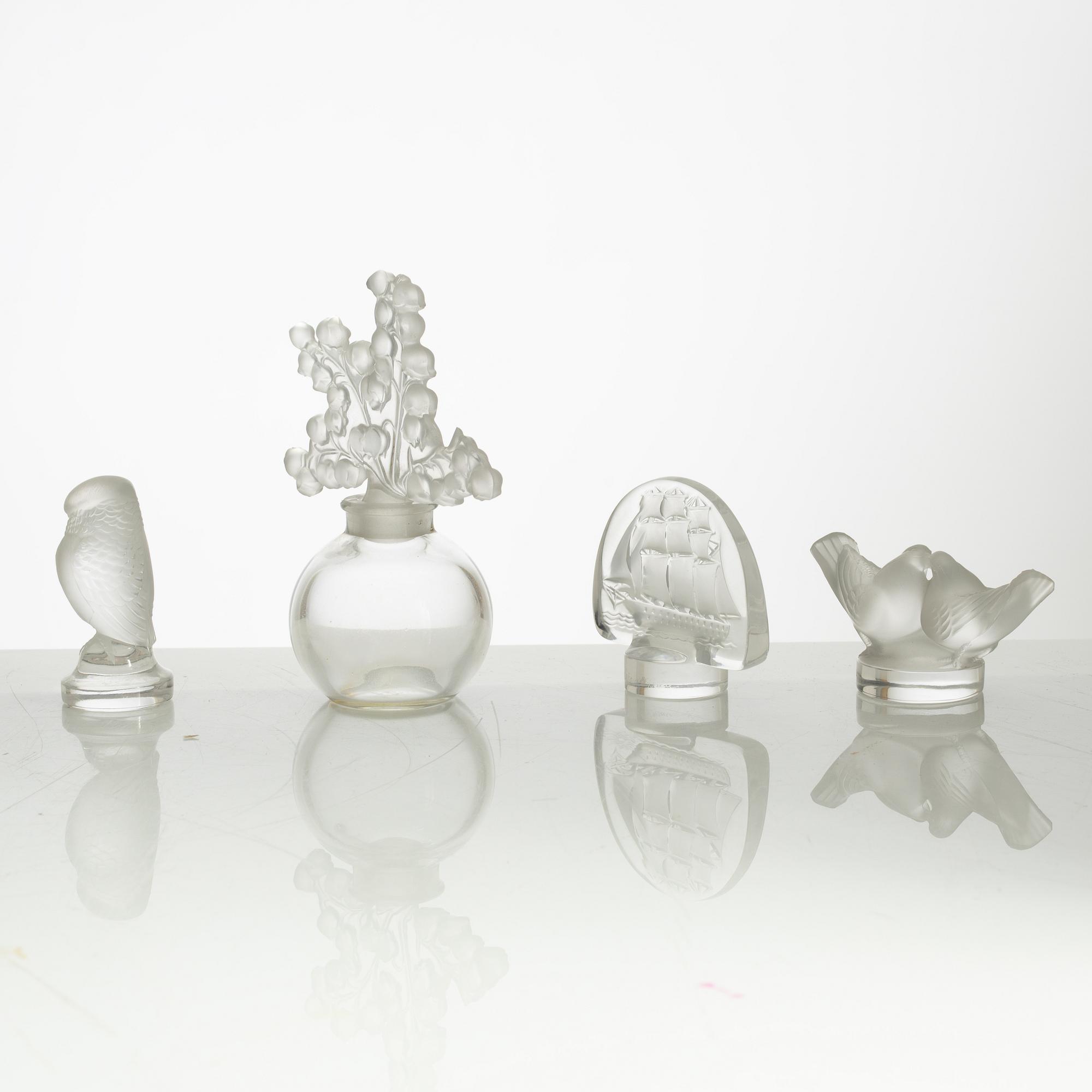 Lalique, four perfume bottles and five figurines, France, after 1945.