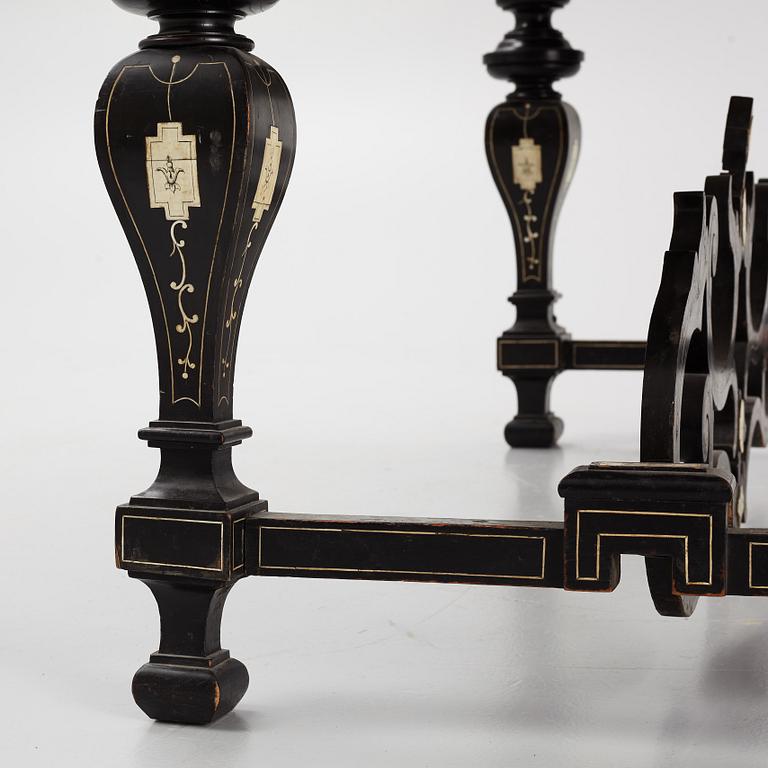 A Renaissance-style ebony, ebonized and ivory-inlaid library table, late 19th century, presumably Germany.