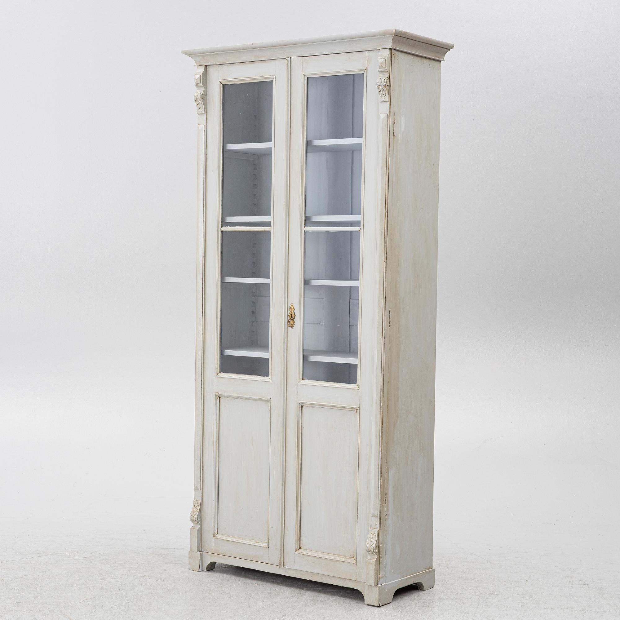 Display cabinet, circa 1900.
