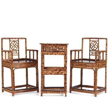 1045. A pair of spotted bamboo chairs and a table, Qing dynasty, 19th Century.