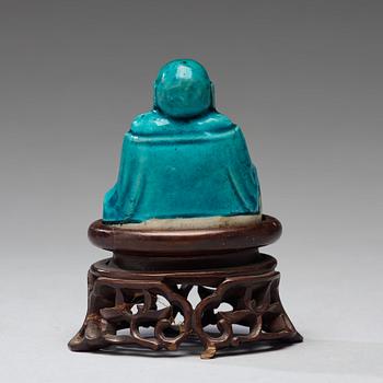 A turquoise glazed figure of Buddai, Qing dynasty, early 18th Century.