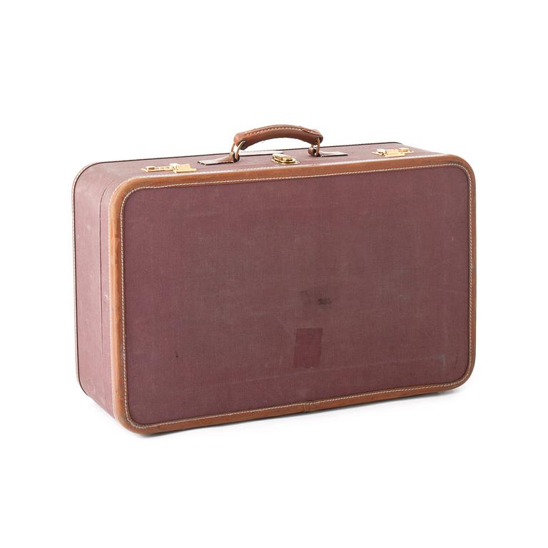 T ANTHONY Ltd, a aubergine canvas suitcase from the 1970s.