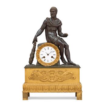 582. An Empire early 19th century gilt and patinated bronze mantel clock.