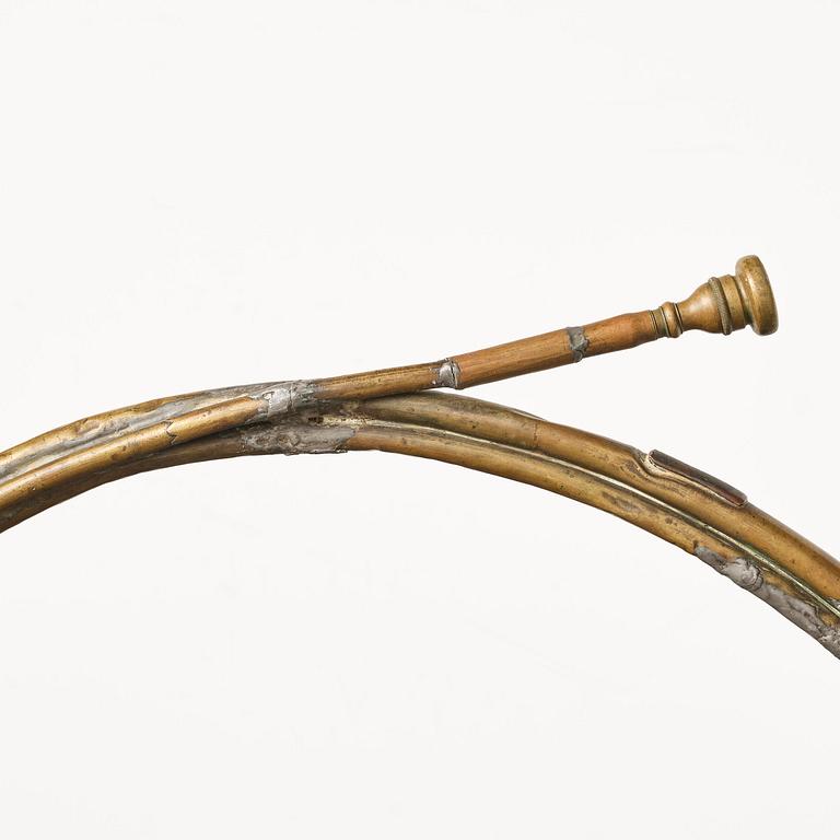 A brass hunting horn by Pierre Raoux (manufacturer of horns in Nancy, fl. ca 1723 -1789.).