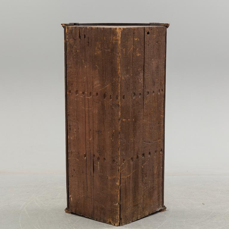 A 19th century corner cabinet.