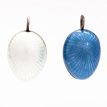 Two sterling silver pendant with enamel with the form of eggs.