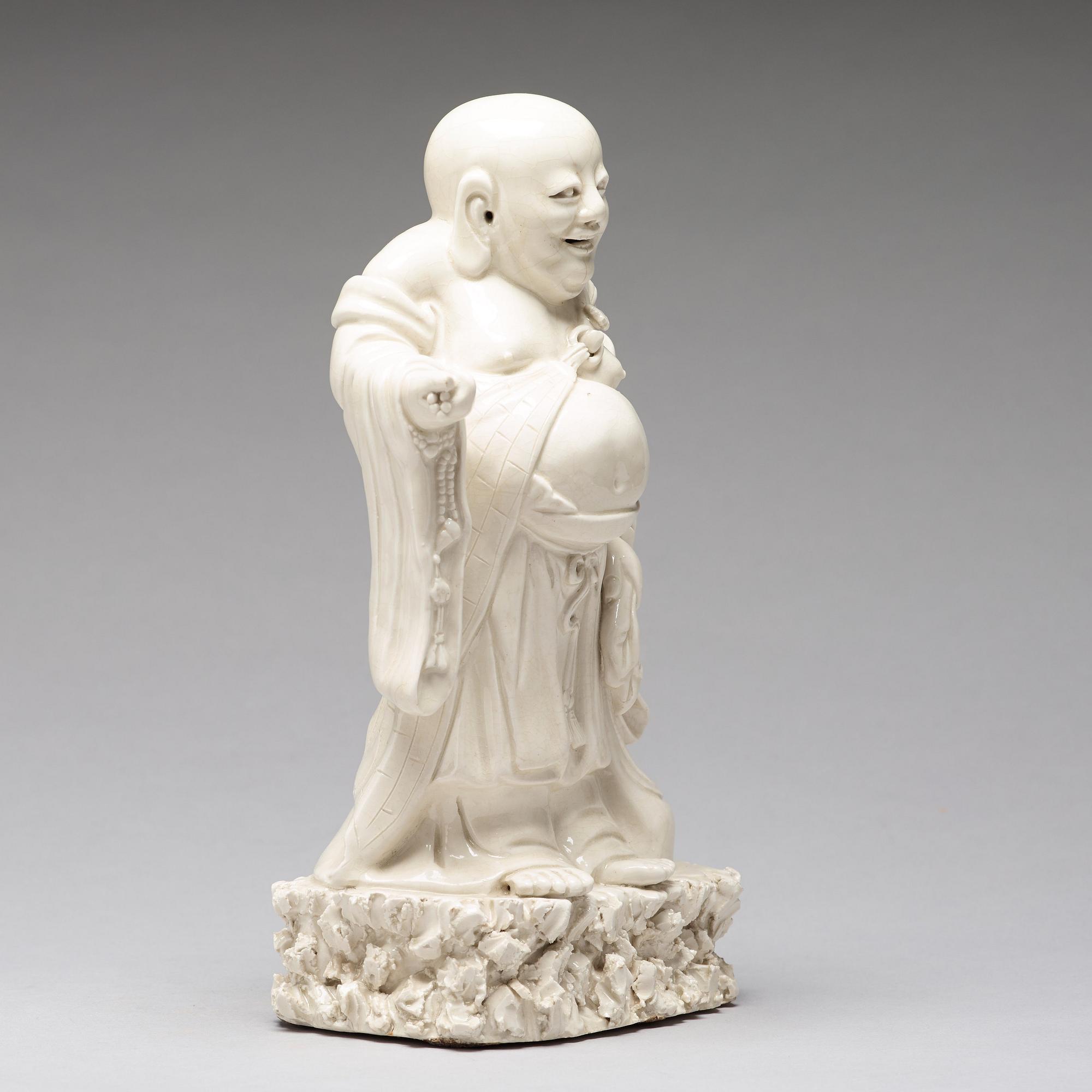 A blanc de chine figure of Buddai, Qing dynasty.
