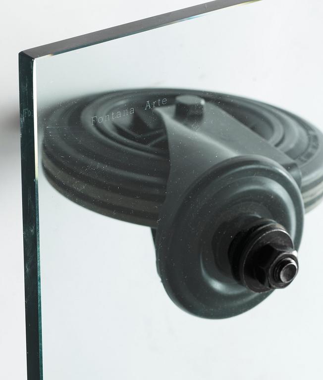 A Gae Aulenti 'Tavola con Ruote' table, Fontana Arte, Italy.