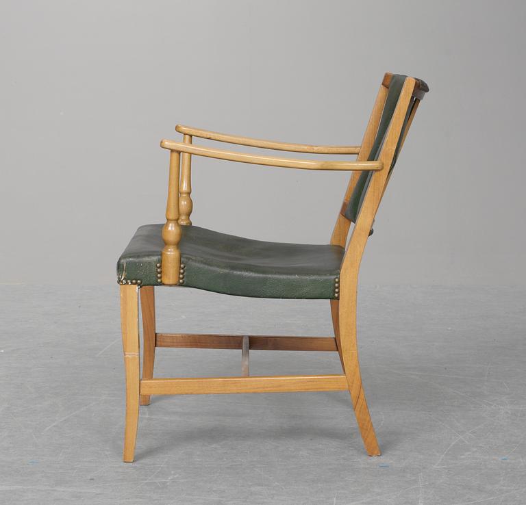 A Josef Frank mahogany and green leather easy chair, Firma Svenskt Tenn.