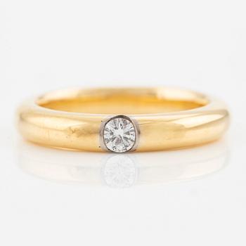 Ring in 18K gold with a round brilliant-cut diamond.