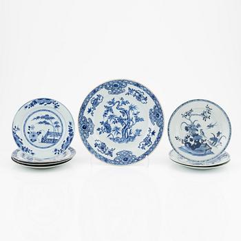 A blue and white dish and seven odd dinner plates, Qing dynasty, Qianlong (1736-95).