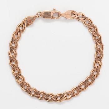 A 14K gold bracelet. Marked Midas.