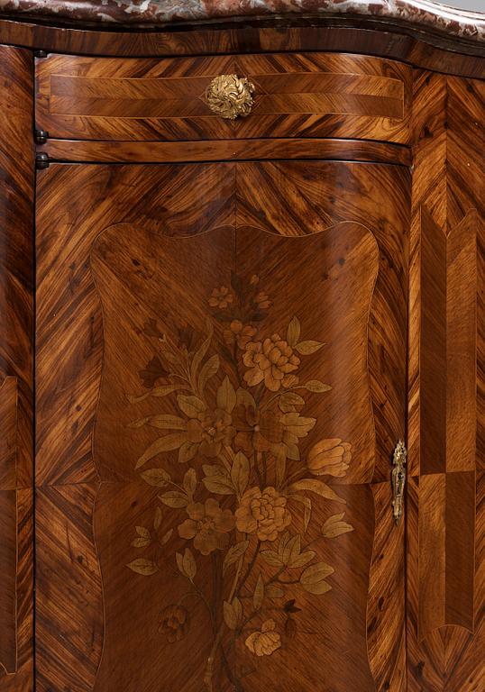 A pair of Louis XV 18th century corner cupboards.