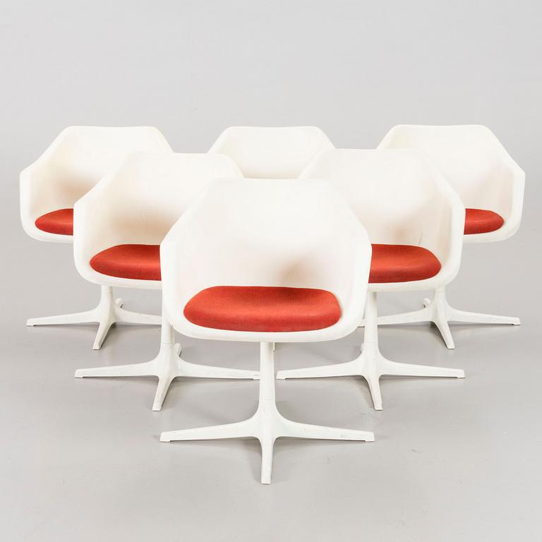 Six Robin Day armchairs.