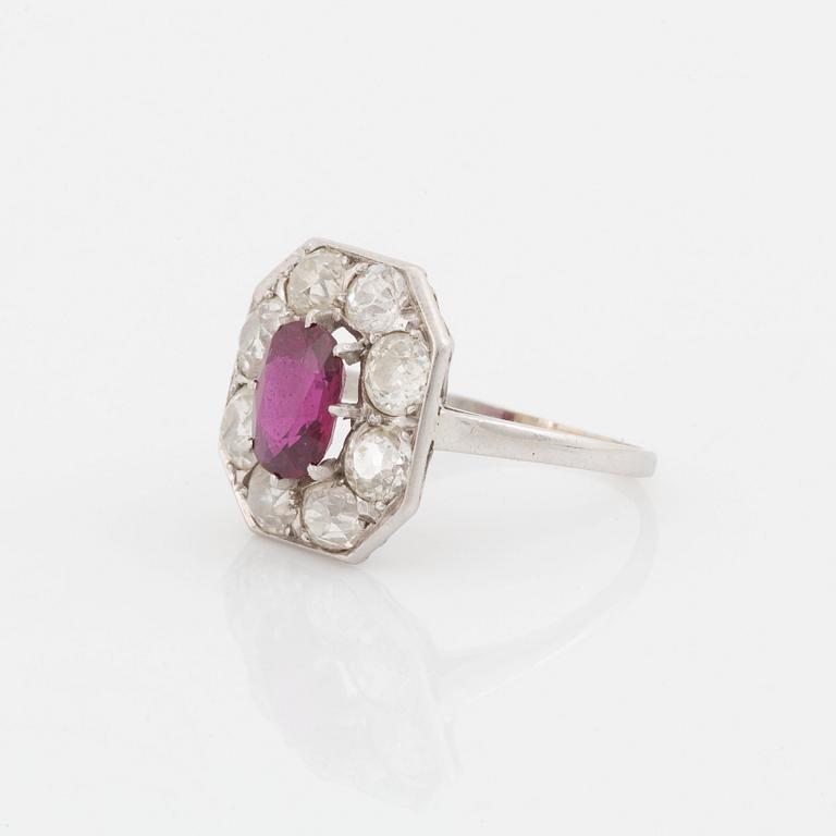 An 18K white gold ring set with a ruby and old-cut diamonds.