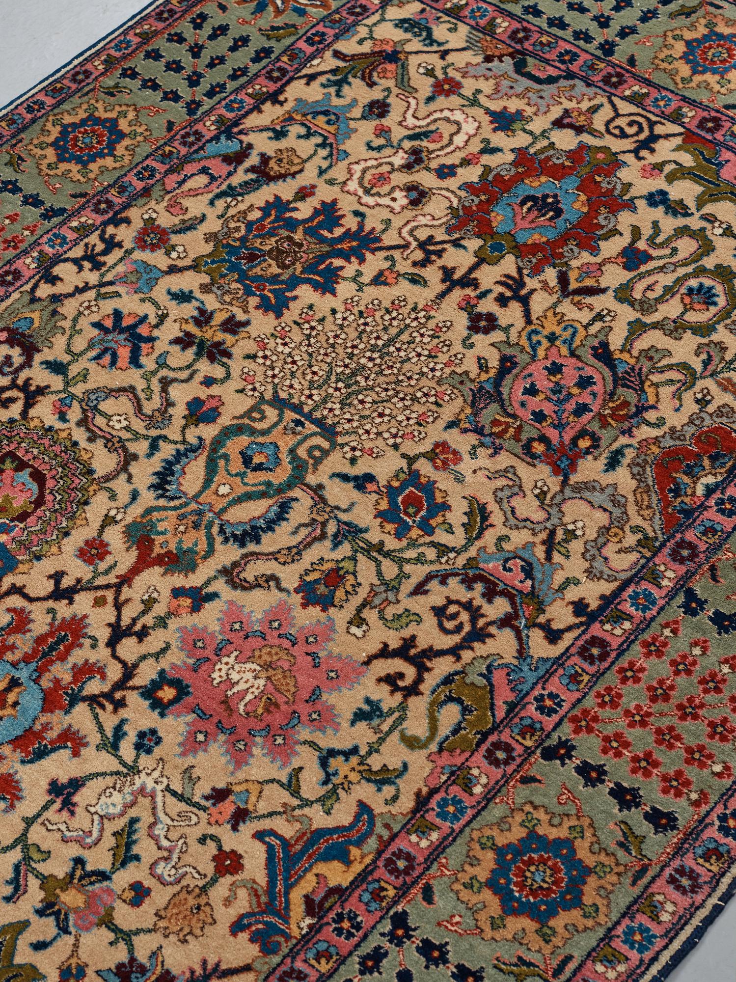 A RUG, a semi-antique Tabriz, ca 198 x 142 cm.