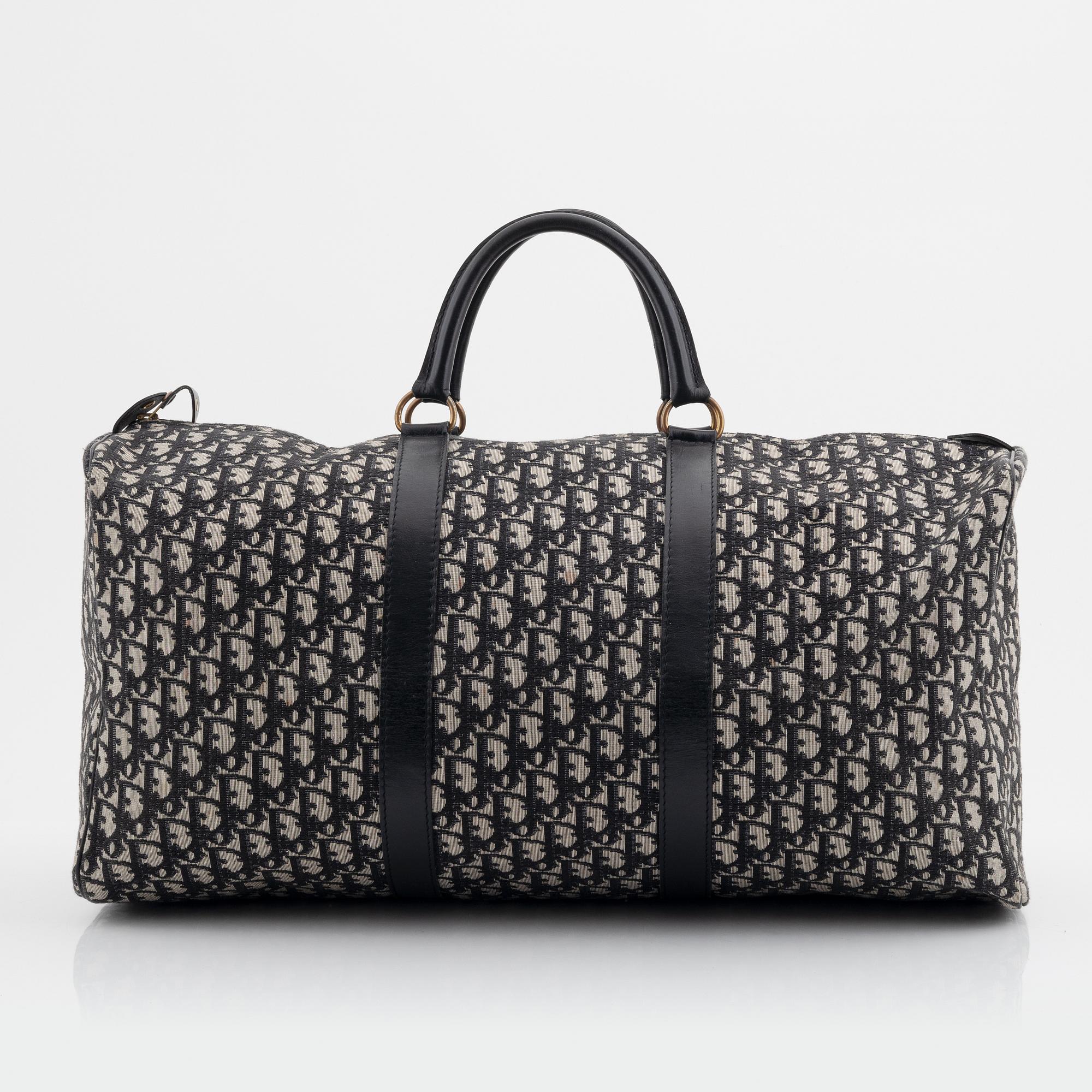 Christian Dior, a canvas weekend bag and umbrella.
