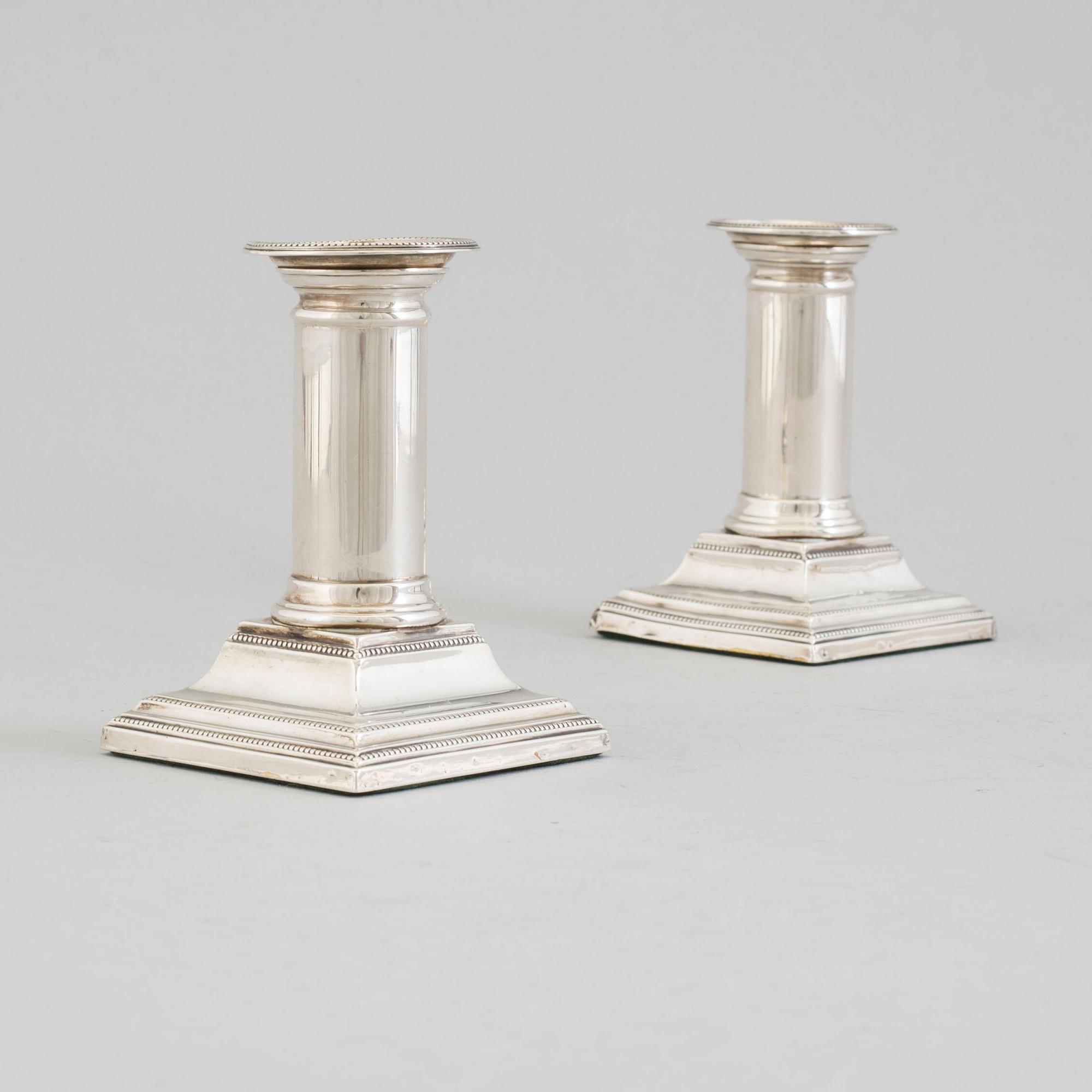 JAMES KABBERLING BEMBRIDGE, a pair of silver candlesticks from Sheffield, England, 1881.