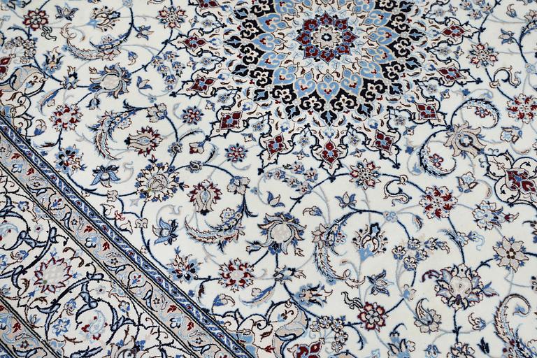 A Nain carpet, part silk, so called 6LAA, approximately 279 x 200 cm.