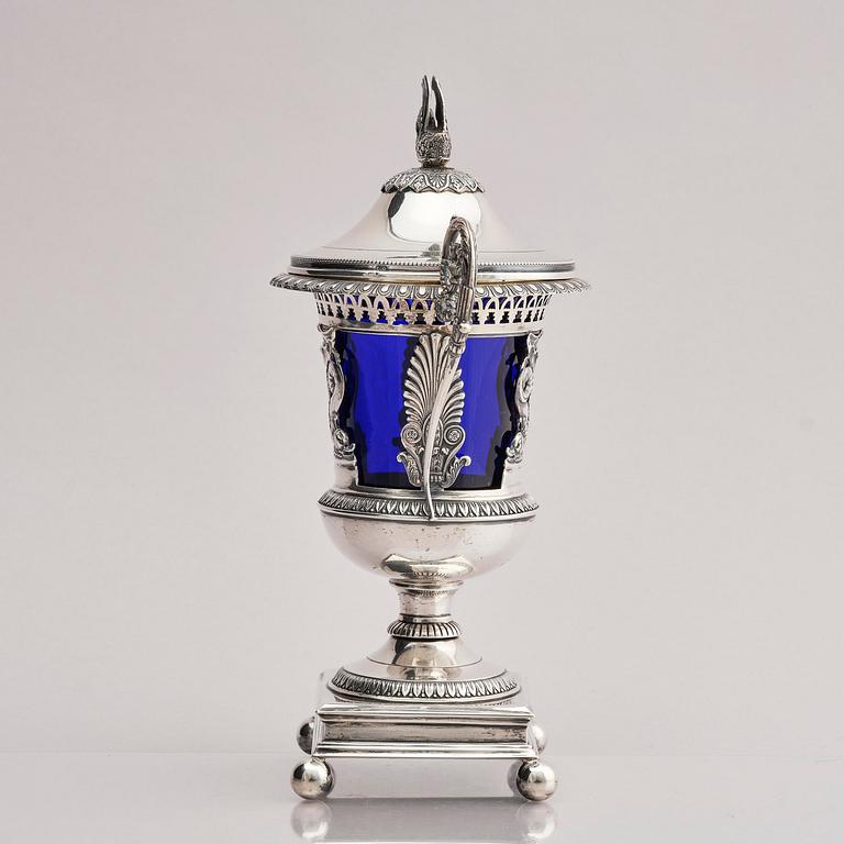 Lockurna, silver med blå glasinsats, Frankrike 1800-talets början.