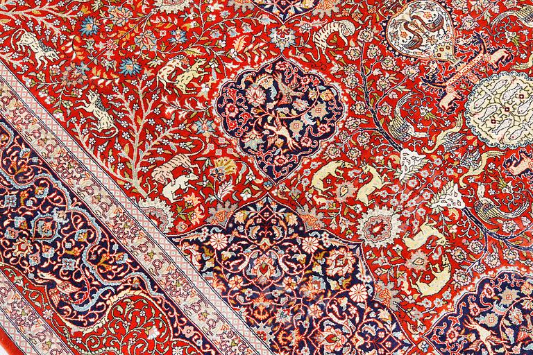 A pictoral orietal silk rug, 246 x 153 cm.