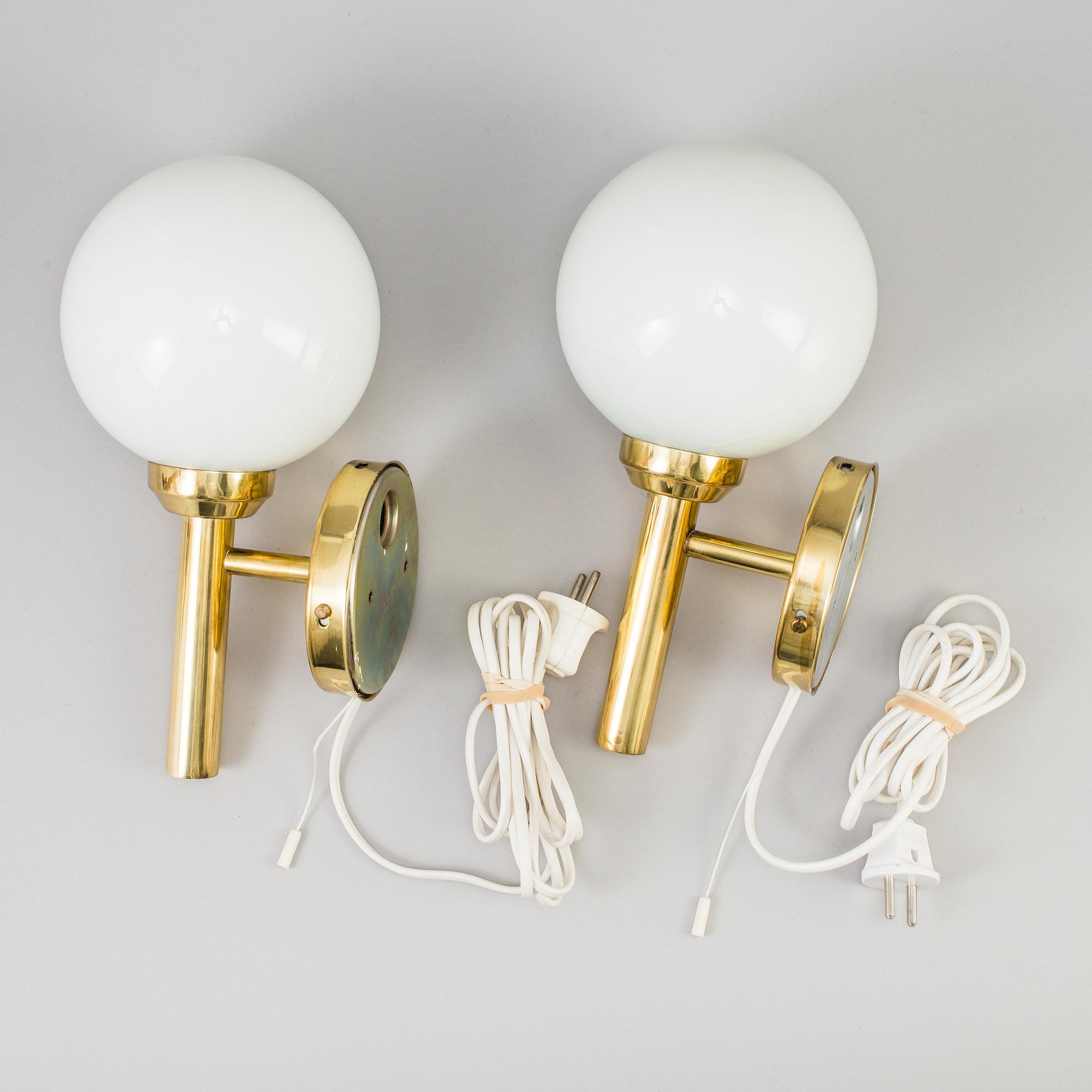 A pair of 20th century brass wall lights by Abo Denmark.