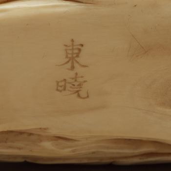 A signed Japanese ivory sculpture, Meiji (1868-1912).