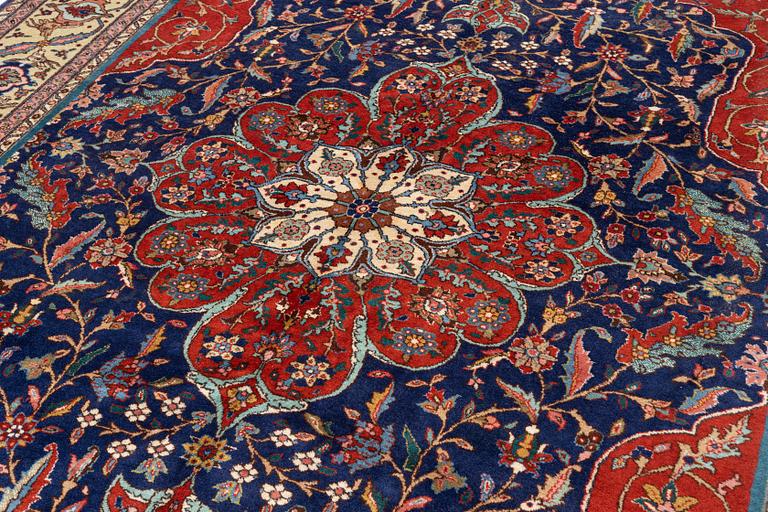 A semi-antique Tabriz, c. 349 x 249 cm.